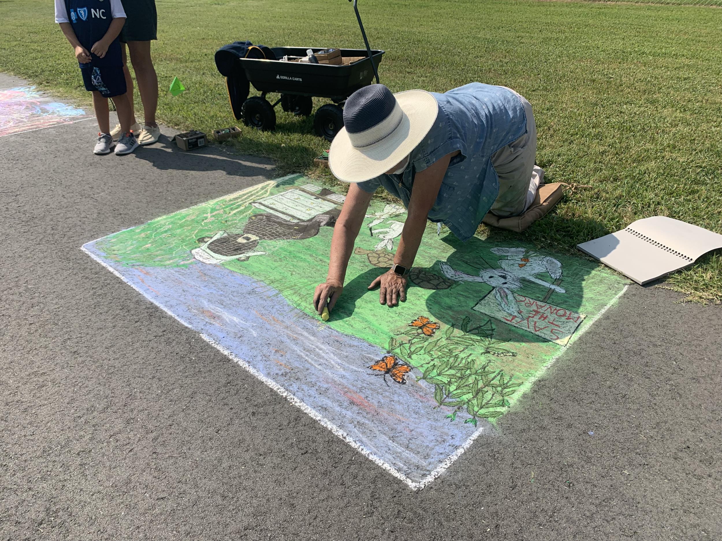 Sidewalk Chalk 2021 - Woman drawing Chatham County images