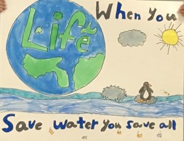 Student poster drawing showing Earth on water saying 