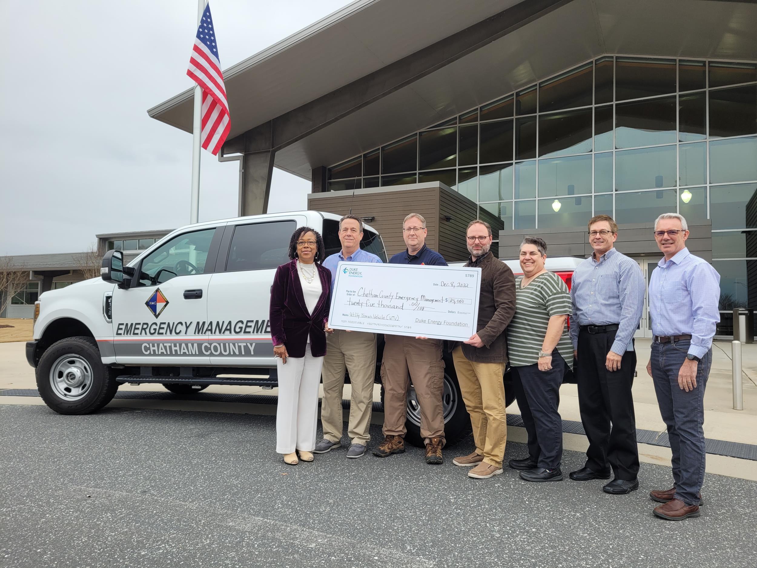 On December 8, 2022, Duke Energy presented Chatham County staff with a check for a $25,000 grant to purchase a utility terrain vehicle. Duke and County staff in front of Ag Center with Emergency Management truck and large check.