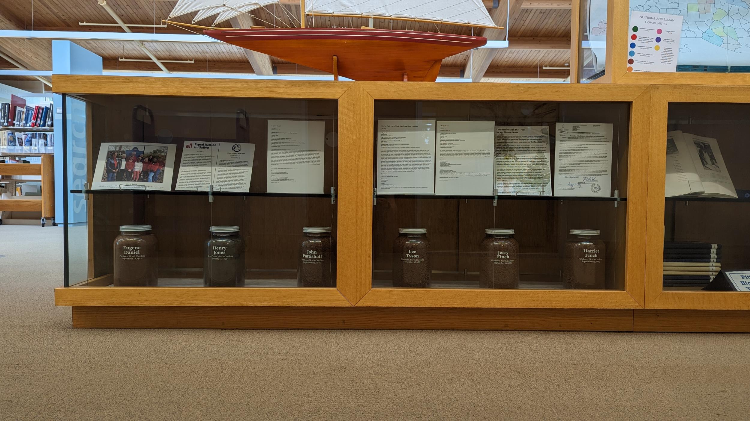 Jars of soil collected from the sites of six lynchings in Chatham County