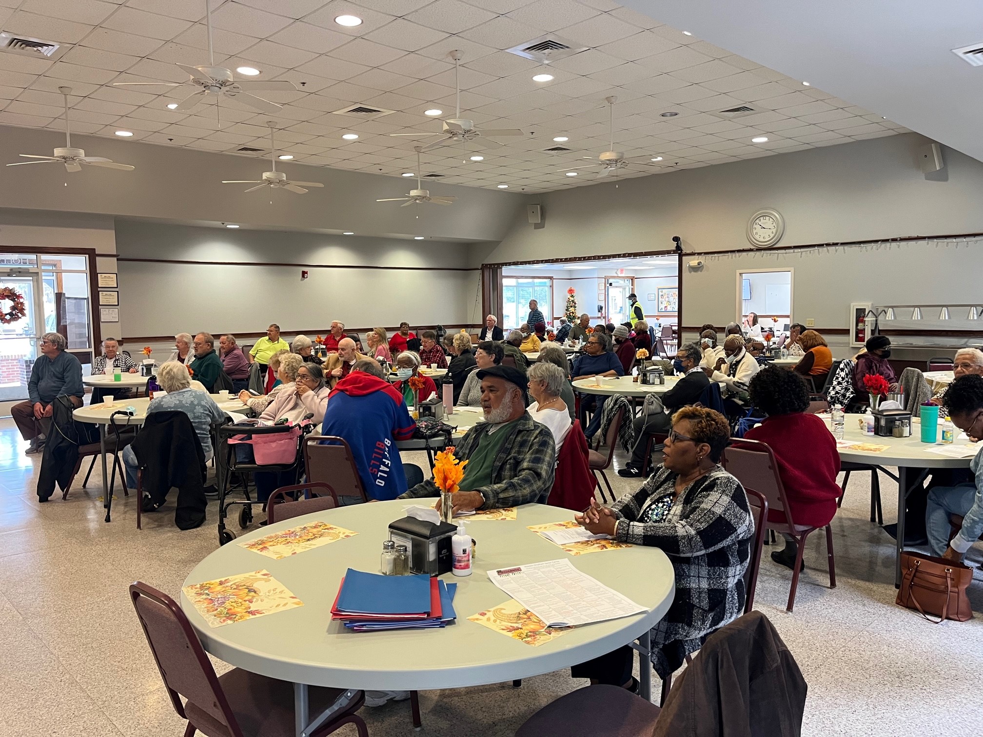 Group of seniors dining at the Western Senior Center