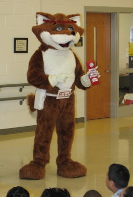 Red Fox visits schools to teach them about calling 911 in emergencies