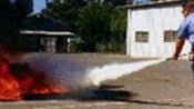 photo of spraying fire extinguisher back and forth